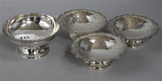 A Goldsmiths & Silversmiths Co. Ltd silver pedestal bowl with cast decoration and a set of three Mappin & Webb bowls